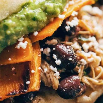 Arepas with sweet potato, carnitas, and black beans.