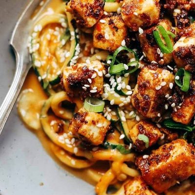 Sesame Zoodles wiht Tofu in a bowl.