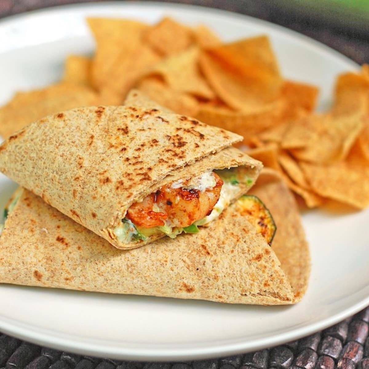 Garlic shrimp and zucchini wrap on a whole wheat tortilla with grilled zucchini.