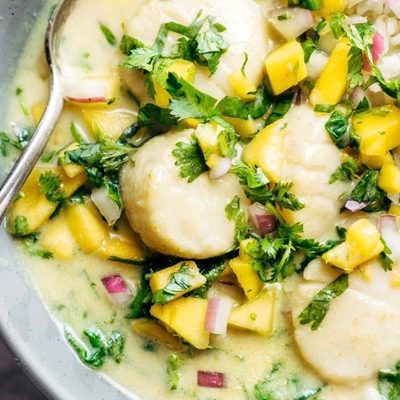 Green Curry Scallops in a bowl with a spoon.