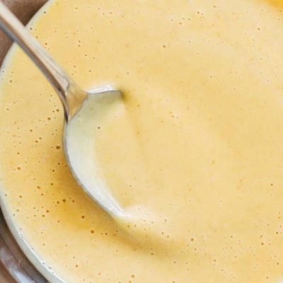 5 Minute Honey Mustard Sauce in a bowl with a spoon.