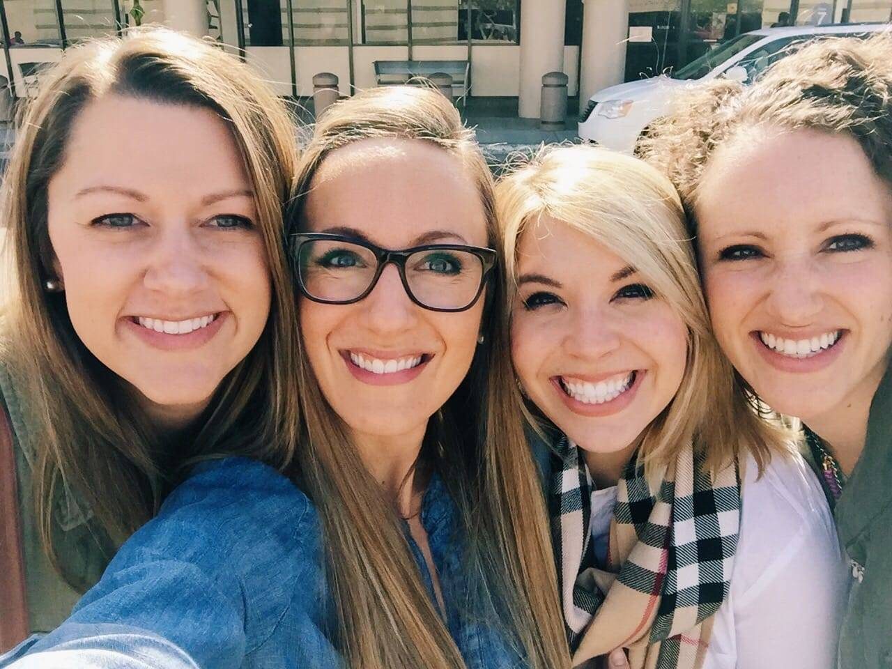 four girls smiling