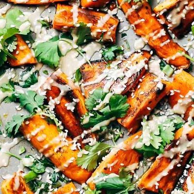Sesame Roasted Sweet Potatoes baked on a sheet pan.