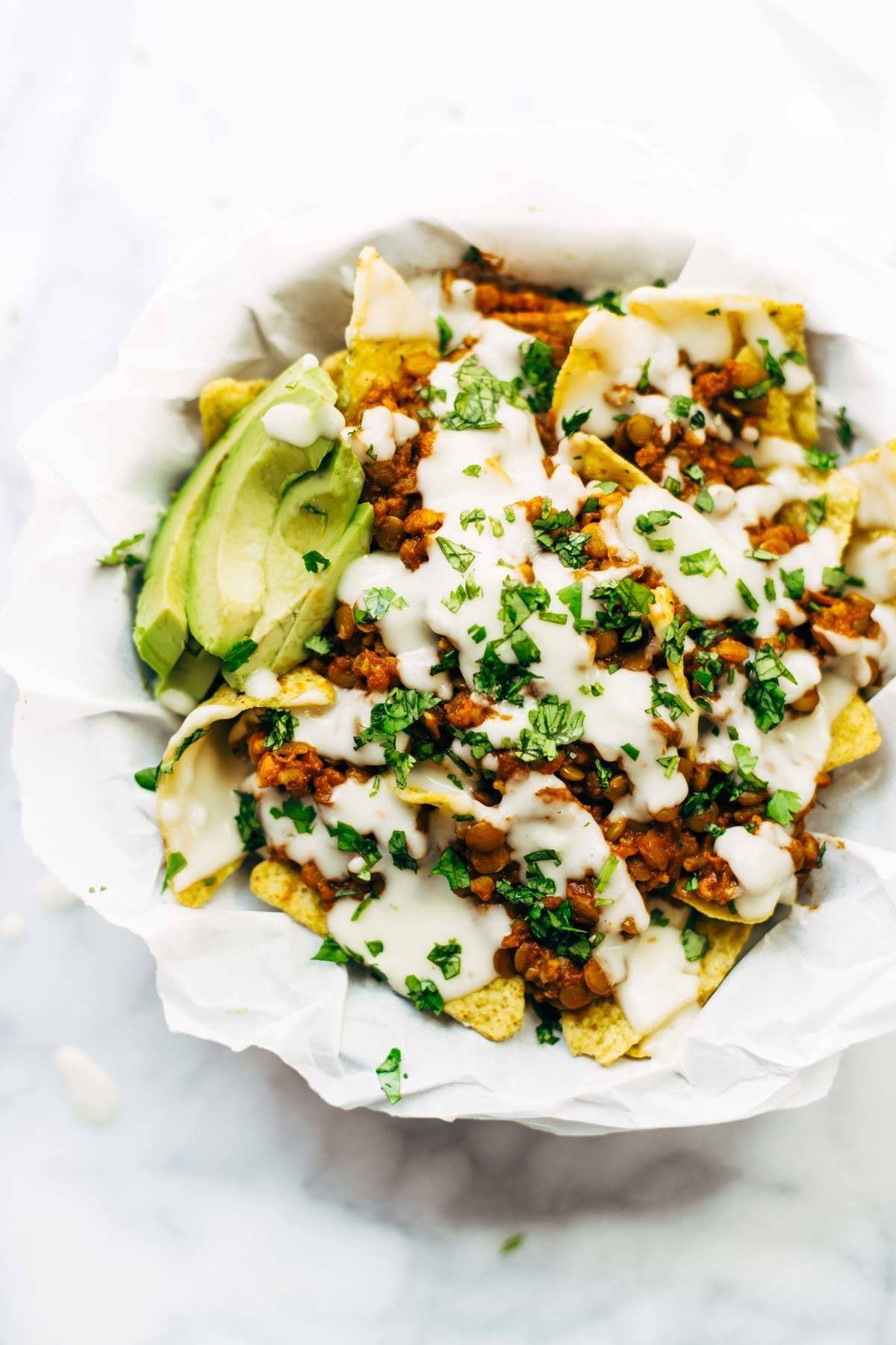 Spicy Lentil Nachos with Three Cheese Sauce - you will not believe how good these are! Saucy filling with a velvety homemade cheese sauce. Vegetarian. | pinchofyum.com Spicy Lentil Nachos with Three Cheese Sauce - you will not believe how good these are! Saucy filling with a velvety homemade cheese sauce. Vegetarian. | pinchofyum.com