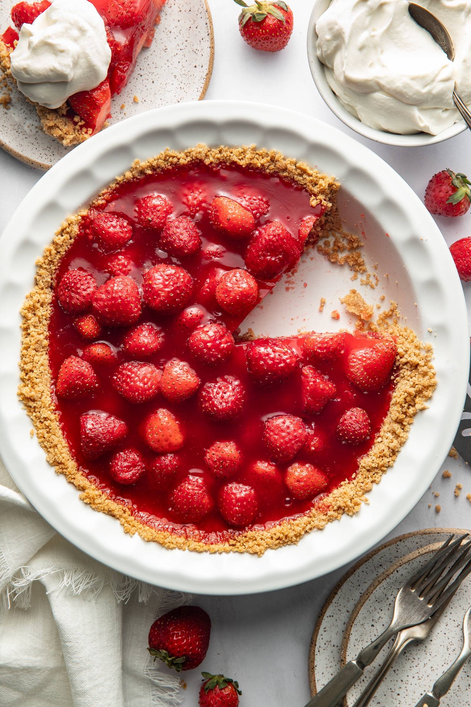Strawberry pie with slice.